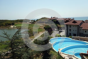 View on swimming pool, lake and sea at Thracian Cliffs resort