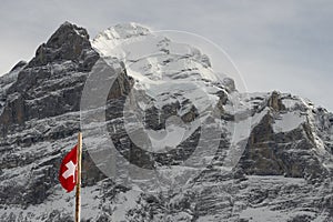 View of the Swiss mountains in winter. Mittelhornin clouds, Schreckhorn and Wetterhorn. Swiss alps in Switzerland Jungfrauregion