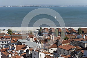 View of the Tagus river with sailboat in Lisbon