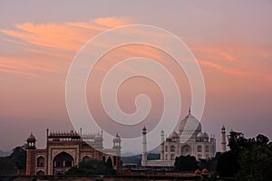 View of Taj Mahal and the Great Gate at sunset in Agra, Uttar Pradesh, India