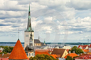 View of Tallinn Old Town, Baltic Sea and St. Olaf in cloudy summer day, Estonia