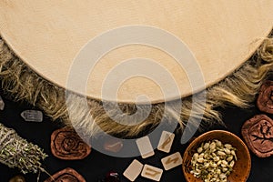 View of tambourine, clay amulets and