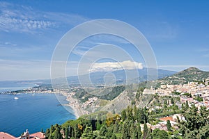 View from Taormina on Giardini Naxos Bay, with Etna volcano in the background in Sicily,