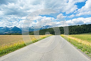 A view of the Tatra Mountains and highway in summer