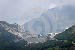 A view of Tebing Soni, Papandayan on the back side with thick vegetaion on it on cloudy grey day. Papandayan Mountain is one of