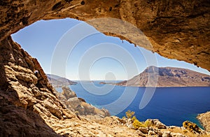 View of Telendos island from a cave in a cliff.