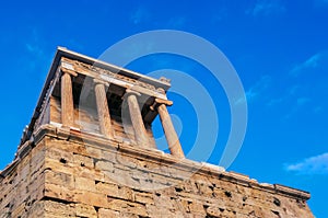 View of temple of Athena Nike at Propylaea entrance gateway, Athens, Greece against blue sky