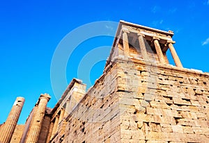 View of temple of Athena Nike at Propylaea entrance gateway, Athens, Greece against blue sky