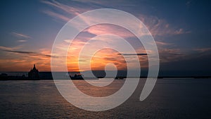 View of the temple at sunset and the confluence of two rivers