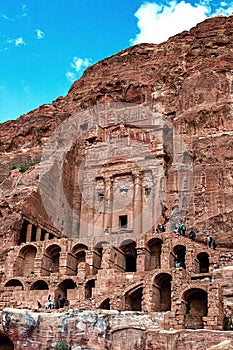 View of the Temples and caves carved into the sandstone rock in the gorge. Petra, Jordan