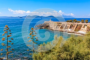 View of the terrace Giovanni Bovio and the lighthouse of Rocchetta in Piombino, Tuscany, Italy, in the background Elba Island