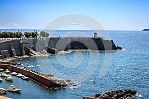 View on the terrace Giovanni Bovio and the lighthouse of Rocchetta in Piombino, Tuscany, Italy