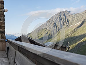 View from terrace of Nurnberger Hutte mountain hut at valley with sharp mountain peaks at Stubai hiking trail, Stubai photo