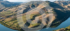 View of the terraced vineyards in the Douro Valley and river near the village of Pinhao, Portugal. Concept for travel in Portugal