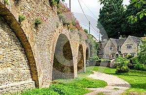 View of the 18th Century Bath Bridge, Tetbury village, The Cotswolds, England, UK photo