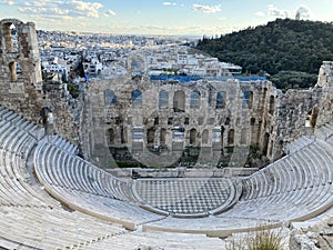 View of the Theatre of Dionysus with the city skyline in the background. Athens, Greece