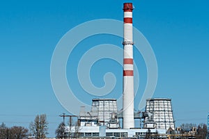 View of a thermal power plant or a factory for the production and processing of petroleum products. Large industrial chimneys