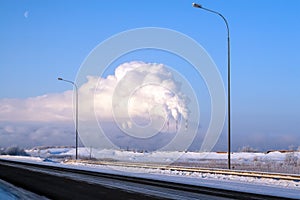 View of the thermal power plants from the highway. Pipes of thermal power plants emit thick smoke. Thermal power plants in thick