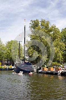 View of three children swimming in canal