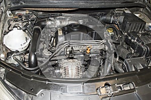 View of the three-cylinder diesel engine installed under the hood of the car
