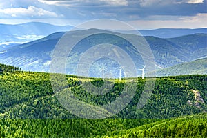 View of three wind power plants in the mountains