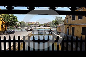 View of the Thu Bon River from inside the Japanese Bridge in Hoi An, Vietnam