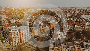 View of the tiled red roofs of Brussels Belgium on a sunny day. Quiet residential area. Travel in Europe. An aerial view drone