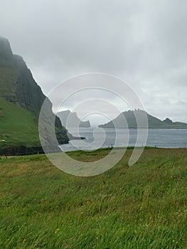 A view at the TindhÃ³lmur Island from GÃ¡sadalur village, VÃ¡gar, Faroe Islands