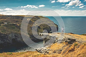View of Tintagel from nearby headland photo