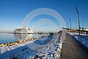 View to Aida Vita cruise ship moored at the dock at cruise port with the sunny winter weather.