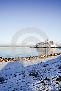 View to Aida Vita cruise ship moored at the dock at cruise port with the sunny winter weather.
