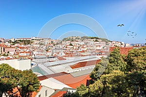 View to Alfama castle from Bairro Alto district in the historic center of Lisbon, traditional roofs in the old town, Portugal photo