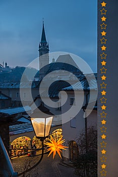 view to alleyway and church at old town salzburg, festive lantern