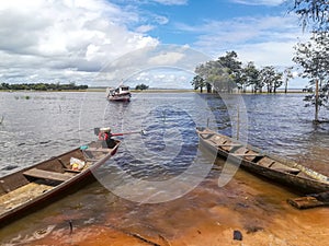 View to Amazon river and traditional boats in the Brazilian Rainforest,