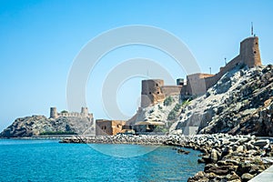 View to the arabian Al Mirani and Al Jalali castles standing on the rocks, Muscat, Oman