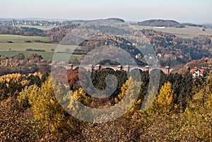 View to autumn Elstertal valley with Elstertalbrucke brick bridge from Julius-Mosen-Turm lookout