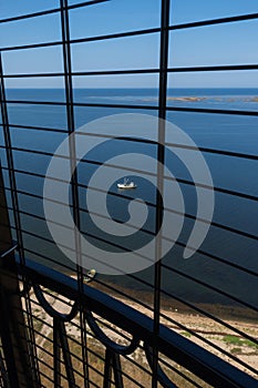 View to the Baltic sea and SÃµrve peninsula through the protective grid  and railings from top of the SÃµrve lighthouse