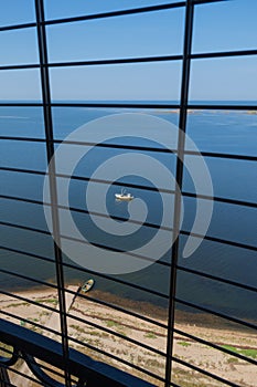 View to the Baltic sea and SÃµrve peninsula through the protective grid  and railings from top of the SÃµrve lighthouse