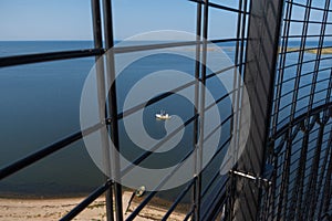 View to the Baltic sea and SÃµrve peninsula through the protective grid  and railings from top of the SÃµrve lighthouse