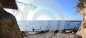 View to the Baltic Sea from the washed out steep coast on the west shore of the German island Poel on a sunny day, blue sky with