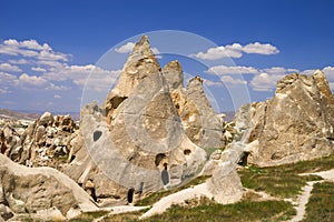 View to cliff dwellings in Cappadocia, Turkey. Ancient cavetown near Goreme