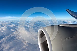 View to clouds through aircraft window
