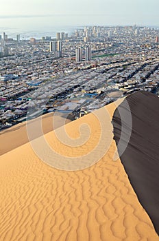 View to coastal city in between desert and ocean