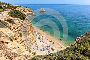 View to coastline with beautiful and sunny portuguese beach Praia da Marinha near Lagoa in summer, Algarve Portugal