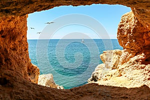 View to coastline with caves at Benagil near beautiful portuguese beach Praia de Carvoeiro near Lagoa in summer, Algarve Portugal