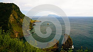 View to coastline of Flores island and Corvo island from Miradouro dos Caimbros, Azores, Portugal