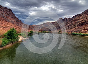 View To Colorado River Surrounded By Red Mountains Near Moab Utah