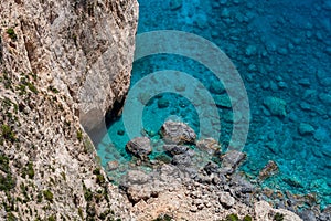 View to the crystal clear blue sea from the cliffs in the southwest of Zakynthos, near Keri