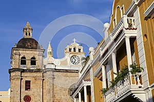 View to ensemble of impressive church San Pedro Claver and traditional colorful houses with blue sky, Cartagena, Colombia, Unesco