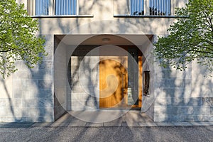 View to entrance door of a modern residential building with new apartments in the city